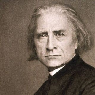 Picture in black and white taken in 1867, showing Liszt wearing a suit. Only his head and shoulders can be seen. His face looks serious.