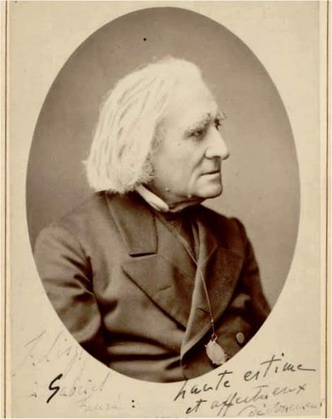 Picture in black and white taken in 1881. It represents Liszt wearing a black cassock and a black coat, with glasses attached to one of his buttons. He looks toward his left. At the bottom of the picture, an inscription in French says "F. Liszt to Gabriel Fauré, high esteem and affectionate devotion."