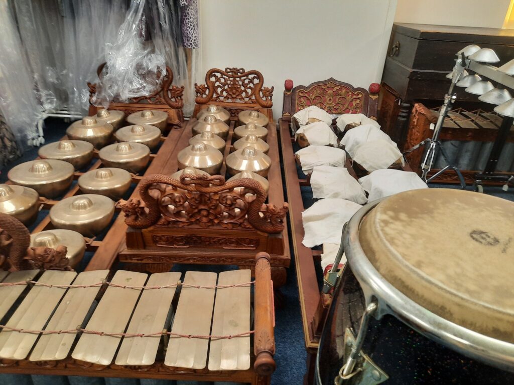 Several percusive instruments with metallic bells and plaques.